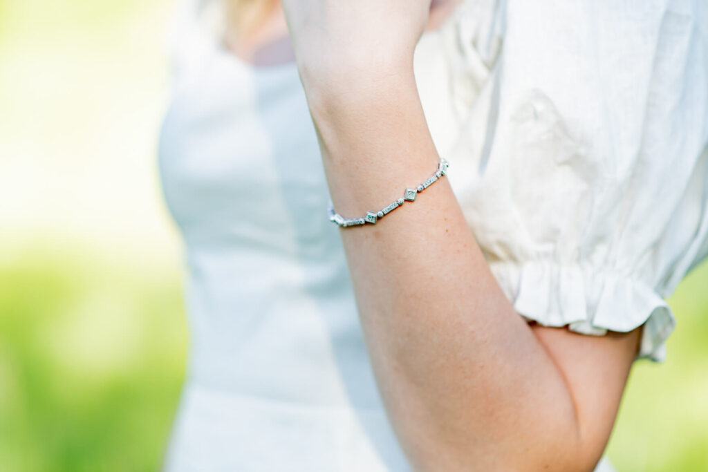 A girl's bracelet on her arm