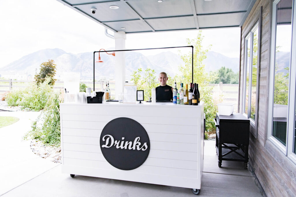 A drink bar with the barista behind