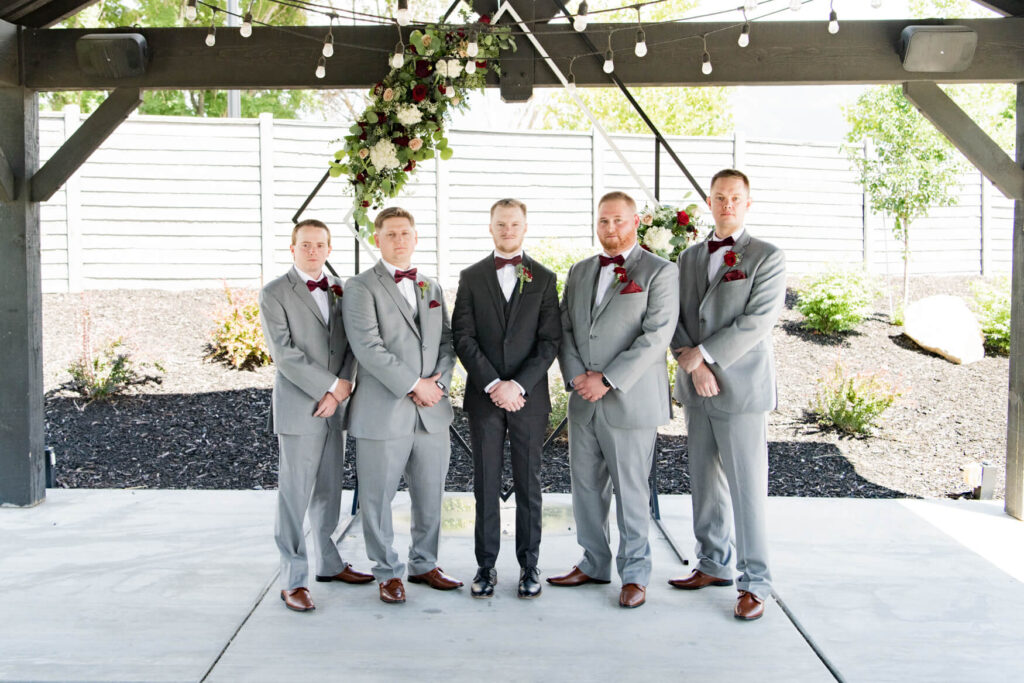 Groom and groomsmen standing together for a picture