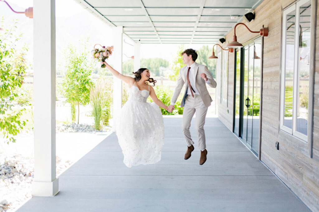 Bride and groom doing a high school musical jump