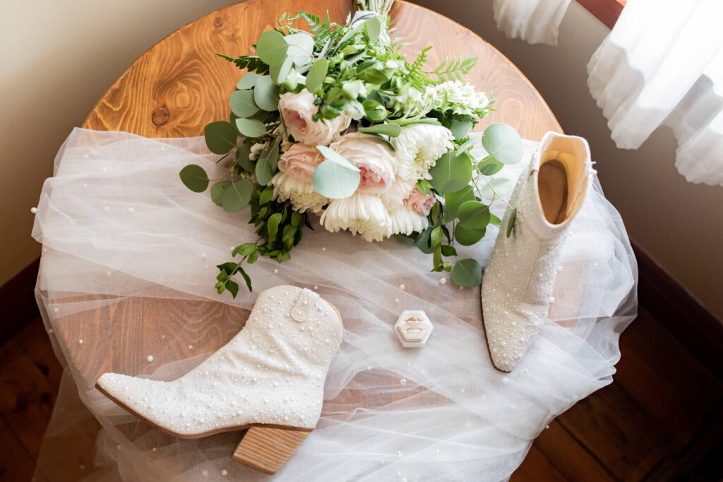 Flat lay setup with flowers, shoes, veil, etc.